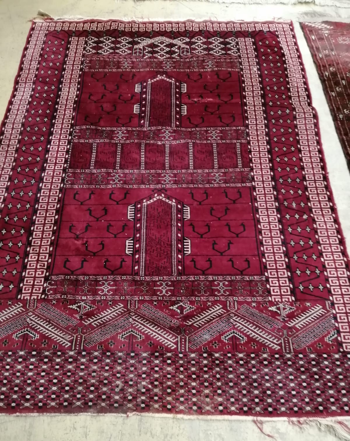 Two Bokhara / Belouch red ground rugs, larger 190 x 120cm